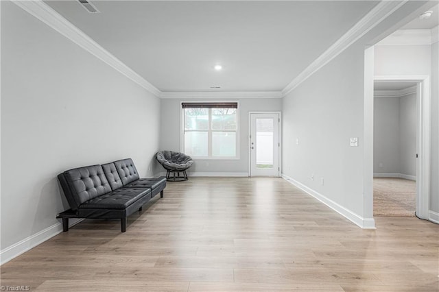 sitting room featuring light hardwood / wood-style flooring and ornamental molding