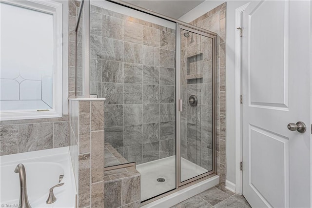 bathroom with shower with separate bathtub