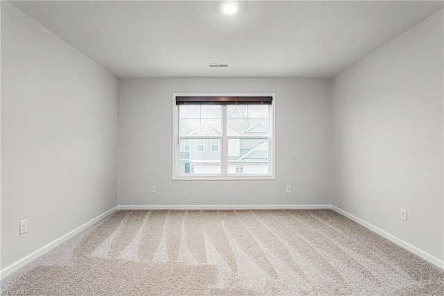 empty room with carpet flooring