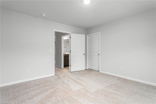 unfurnished bedroom with light carpet