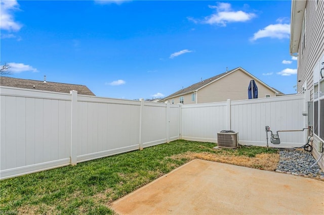 view of yard featuring cooling unit and a patio area