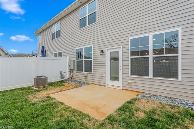 back of house with a yard and a patio area