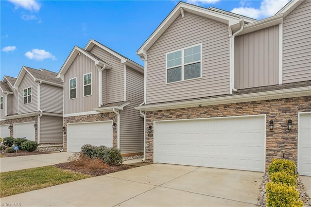 townhome / multi-family property featuring a garage