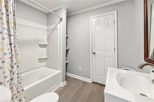 full bathroom with shower / bath combo, baseboards, toilet, crown molding, and wood finished floors