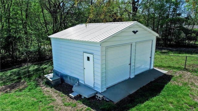 view of shed with fence