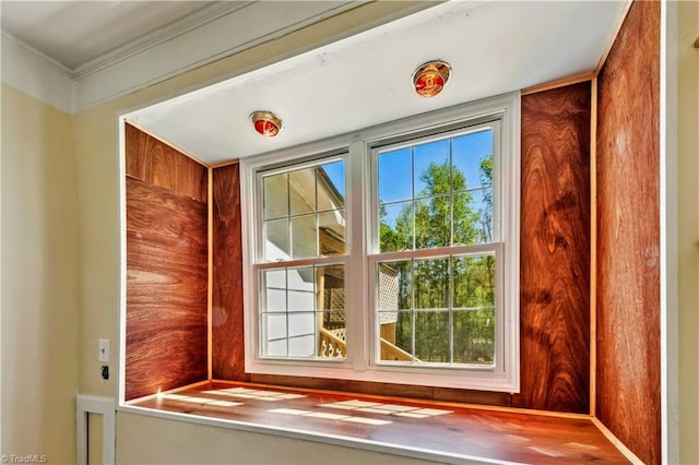 doorway featuring crown molding