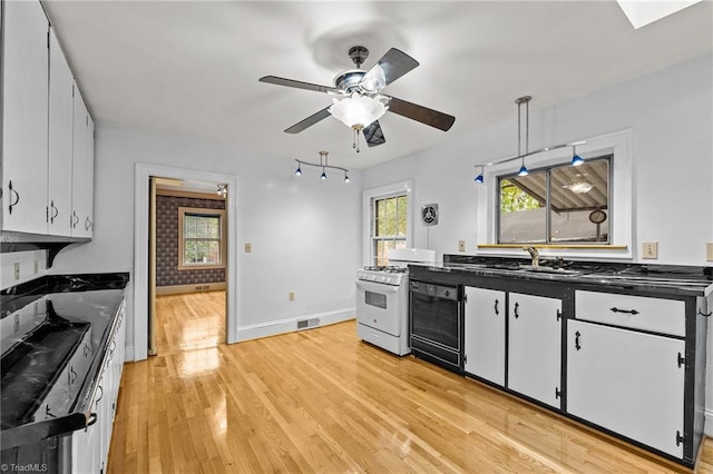 kitchen featuring light wood-type flooring, pendant lighting, white cabinets, dishwasher, and ceiling fan