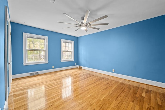 unfurnished room with ceiling fan and light hardwood / wood-style floors