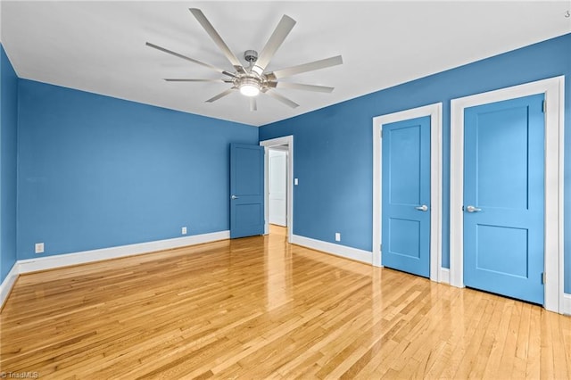 unfurnished bedroom featuring light hardwood / wood-style floors and ceiling fan