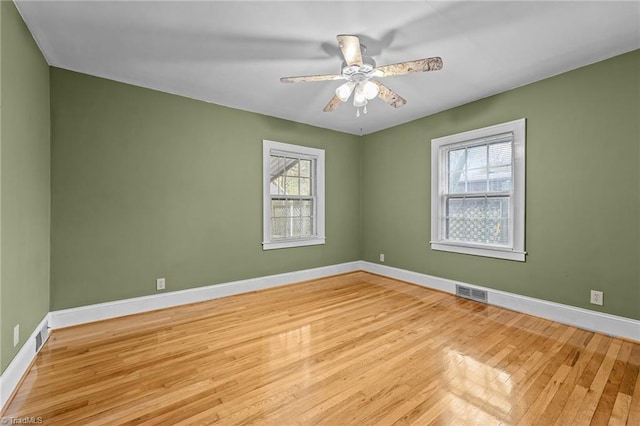 unfurnished room featuring light hardwood / wood-style flooring and ceiling fan