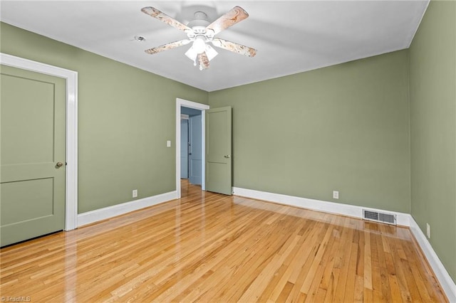 unfurnished bedroom with ceiling fan and light wood-type flooring