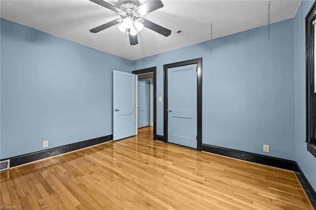 unfurnished bedroom with light hardwood / wood-style floors and ceiling fan