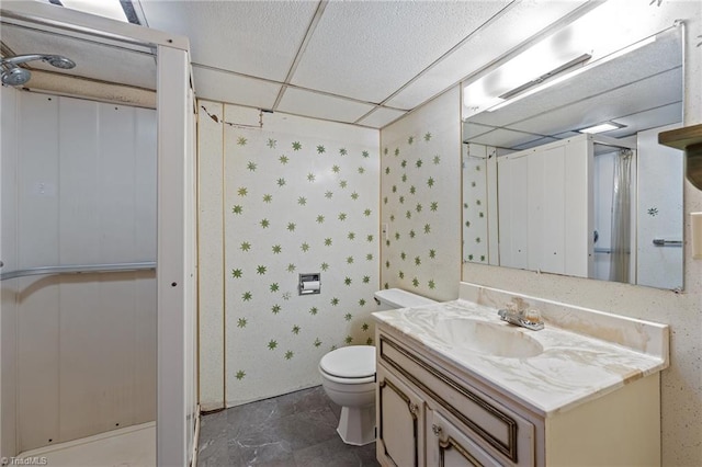 bathroom featuring curtained shower, vanity, and toilet