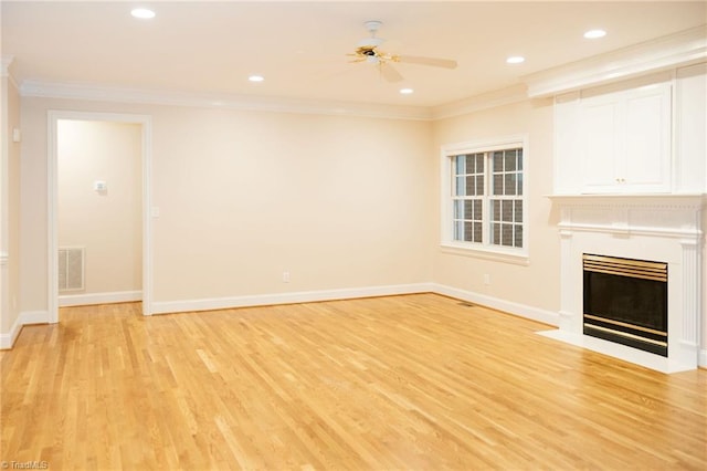 unfurnished living room with crown molding, ceiling fan, and light hardwood / wood-style floors