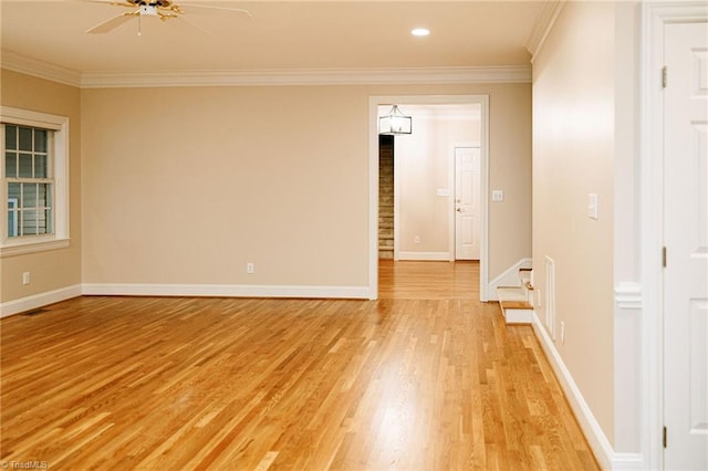 unfurnished room with ceiling fan, light hardwood / wood-style floors, and ornamental molding