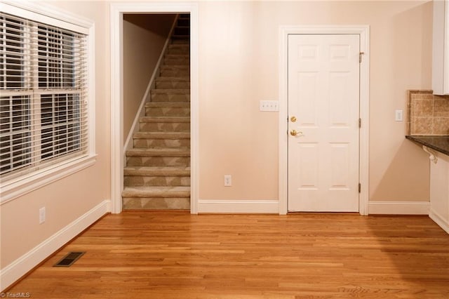 entrance foyer with light hardwood / wood-style flooring