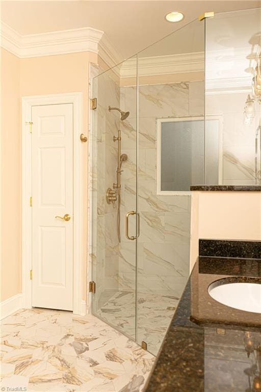 bathroom featuring a shower with door, ornamental molding, and sink