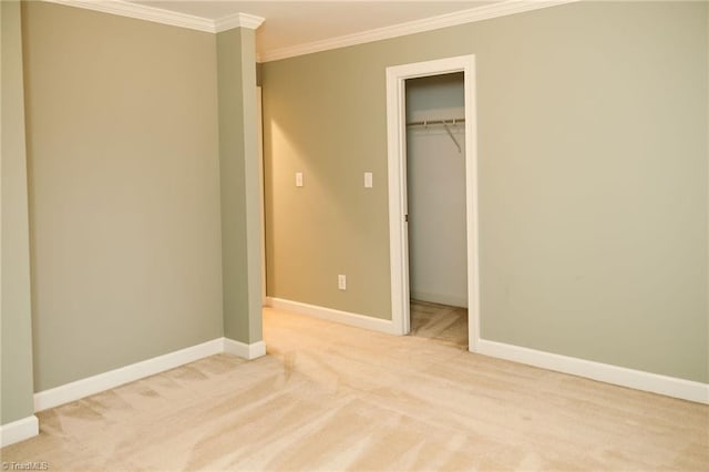 unfurnished bedroom with crown molding, a closet, and light carpet