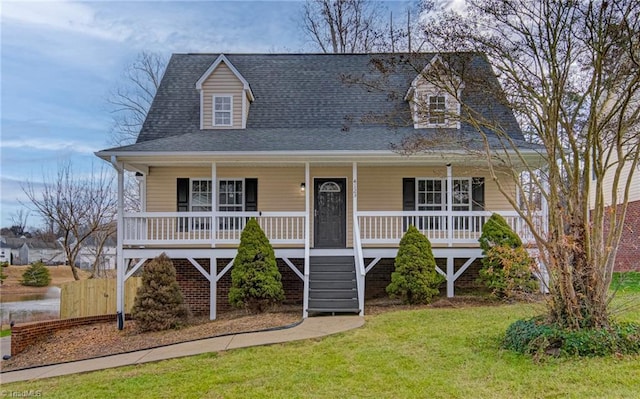 view of front of home featuring a front lawn and a porch