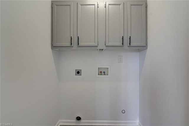 washroom with hookup for an electric dryer, hookup for a washing machine, gas dryer hookup, and cabinets