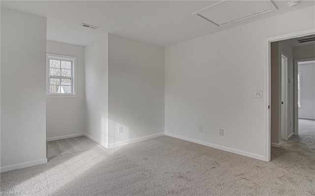 empty room with light colored carpet