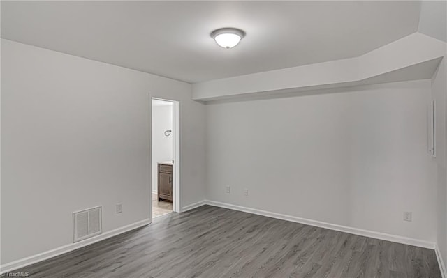 empty room featuring wood-type flooring