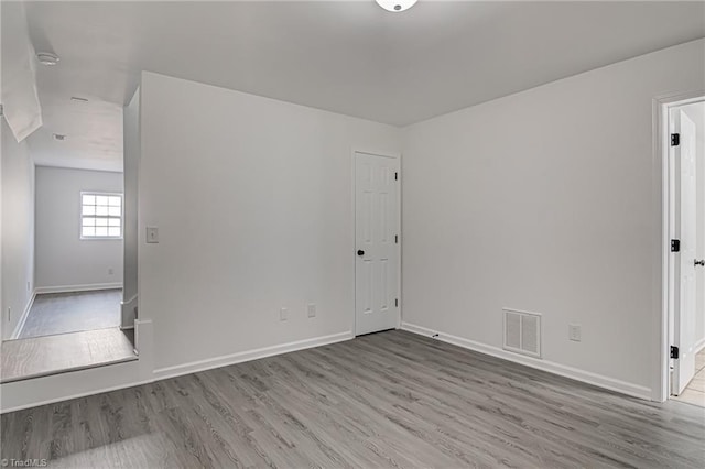 empty room with light wood-type flooring