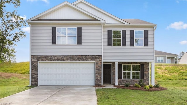 craftsman-style home featuring a front lawn and a garage