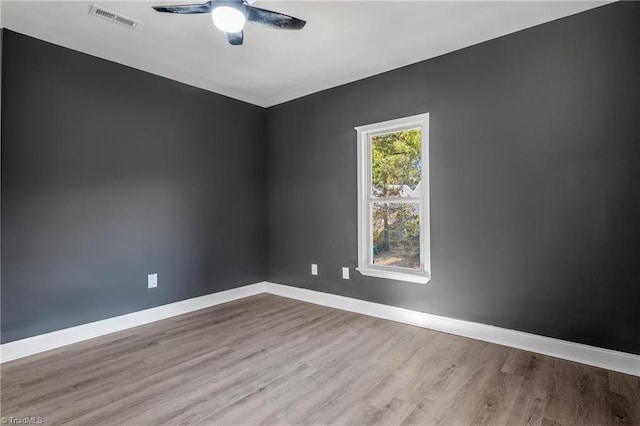 unfurnished room with ceiling fan and light hardwood / wood-style flooring