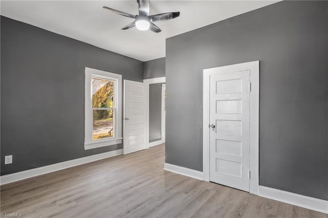 spare room featuring light hardwood / wood-style floors and ceiling fan