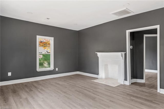 unfurnished living room with light hardwood / wood-style floors