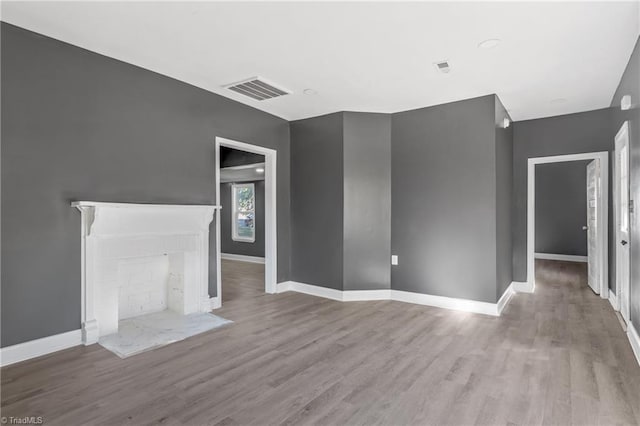 unfurnished living room featuring light hardwood / wood-style floors