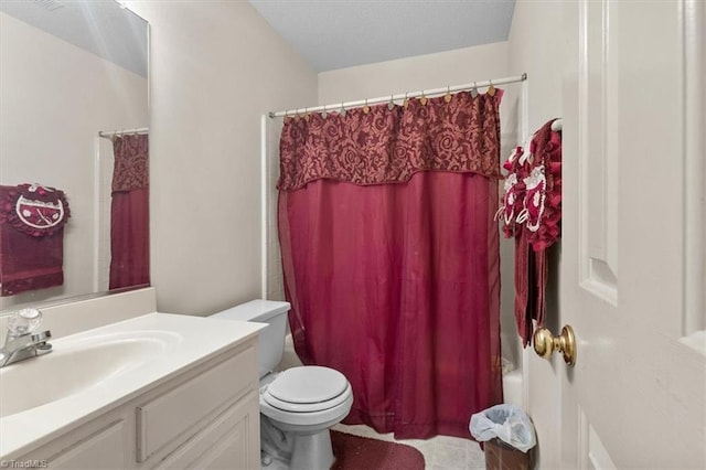 bathroom featuring shower / bathtub combination with curtain, vanity, and toilet
