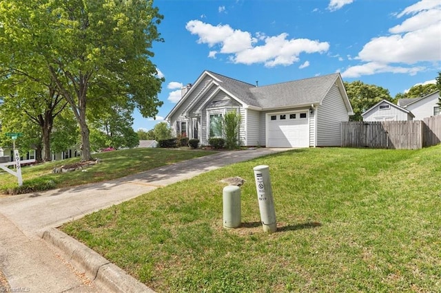 view of front of home featuring a front yard, driveway, a chimney, an attached garage, and fence