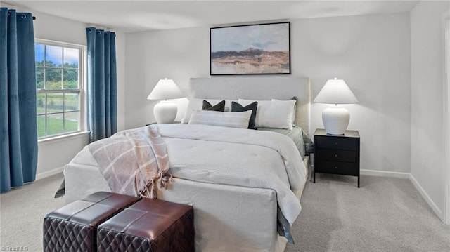 bedroom featuring light carpet