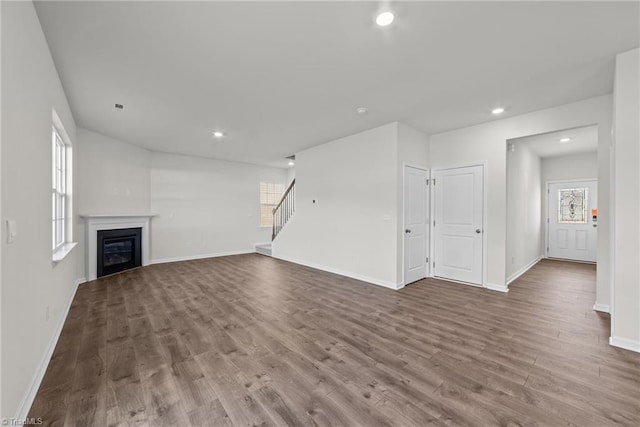 unfurnished living room featuring hardwood / wood-style flooring