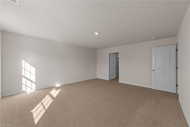 empty room with light colored carpet