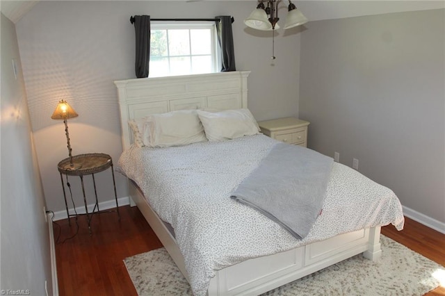 bedroom featuring vaulted ceiling and dark hardwood / wood-style floors