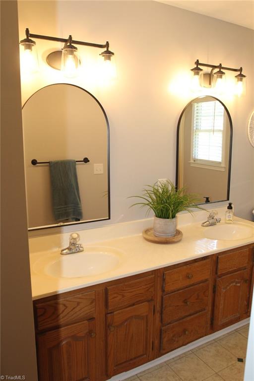 bathroom featuring tile patterned floors and vanity