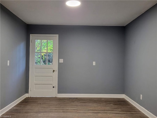 entryway with hardwood / wood-style floors