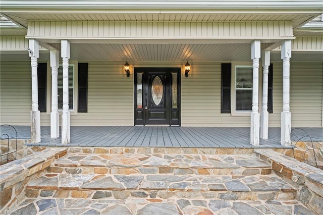 entrance to property featuring covered porch