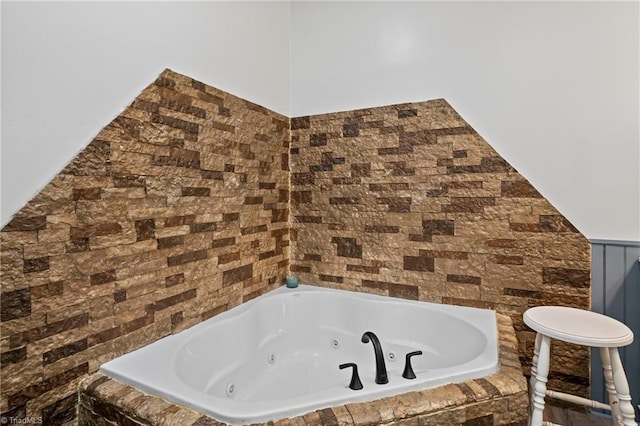 bathroom featuring tiled bath