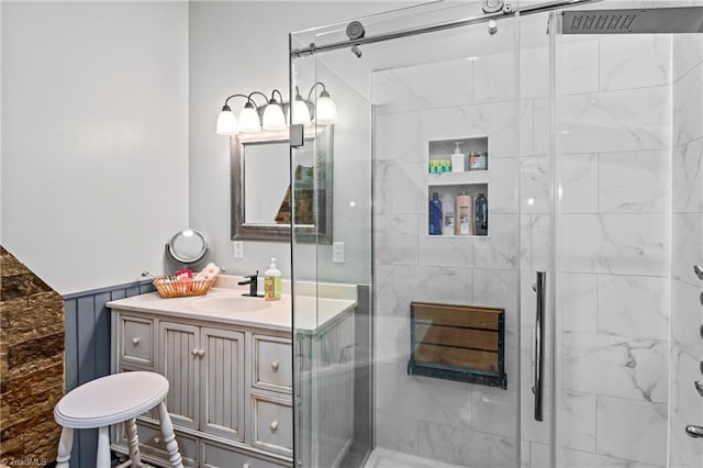 bathroom with vanity and a shower with shower door