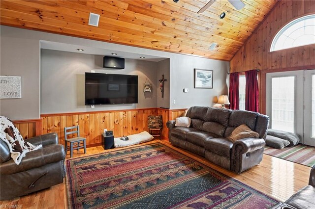 living room with high vaulted ceiling, ceiling fan, wooden ceiling, and hardwood / wood-style flooring