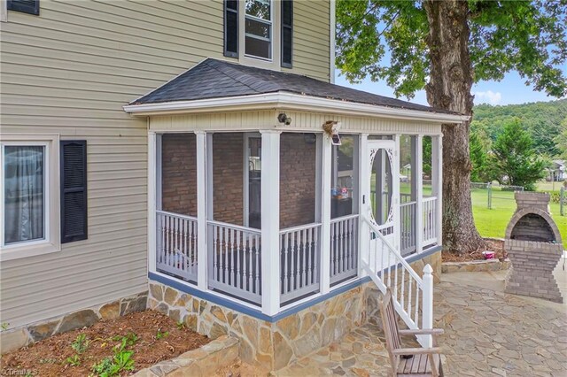 doorway to property with a patio area