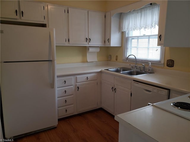 kitchen featuring dark wood-type flooring, white appliances, sink, and white cabinets