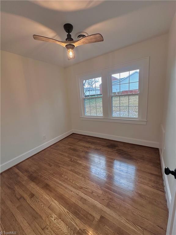 1214 Fillman Dr, Reidsville, NC 27320 - empty room featuring ceiling fan, baseboards, and wood finished floors