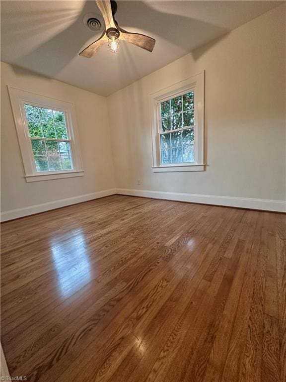 1214 Fillman Dr, Reidsville, NC 27320 - unfurnished room with dark wood finished floors, a ceiling fan, and baseboards