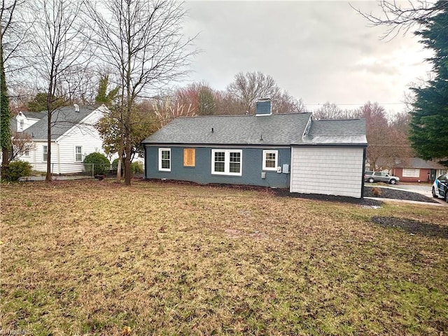1214 Fillman Dr, Reidsville, NC 27320 - back of property featuring a lawn and a chimney