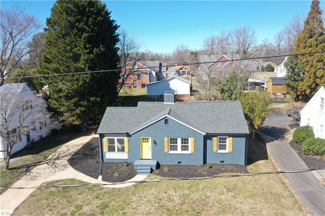 1214 Fillman Dr, Reidsville, NC 27320 - view of front of home with driveway, a front lawn, a residential view, a shingled roof, and crawl space